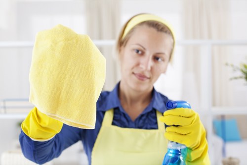 Worker handling carpet cleaning tasks with protective care